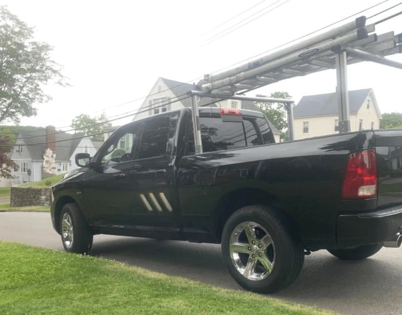 Fleet vehicle cleaning service being performed by Bedford Power Washing in Bedford